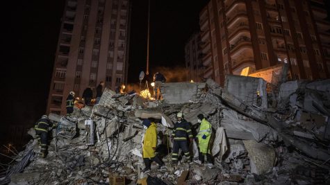  Search and rescue team looks for survivors in a collapsed building