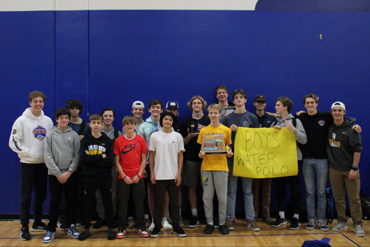 The Barlow boys water polo program poses with their state championship trophy after the Fall Recognition Assembly.