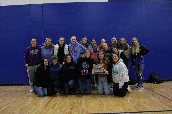 The Barlow girls water polo team poses with their 4th place state trophy after the Fall Recognition Assembly.