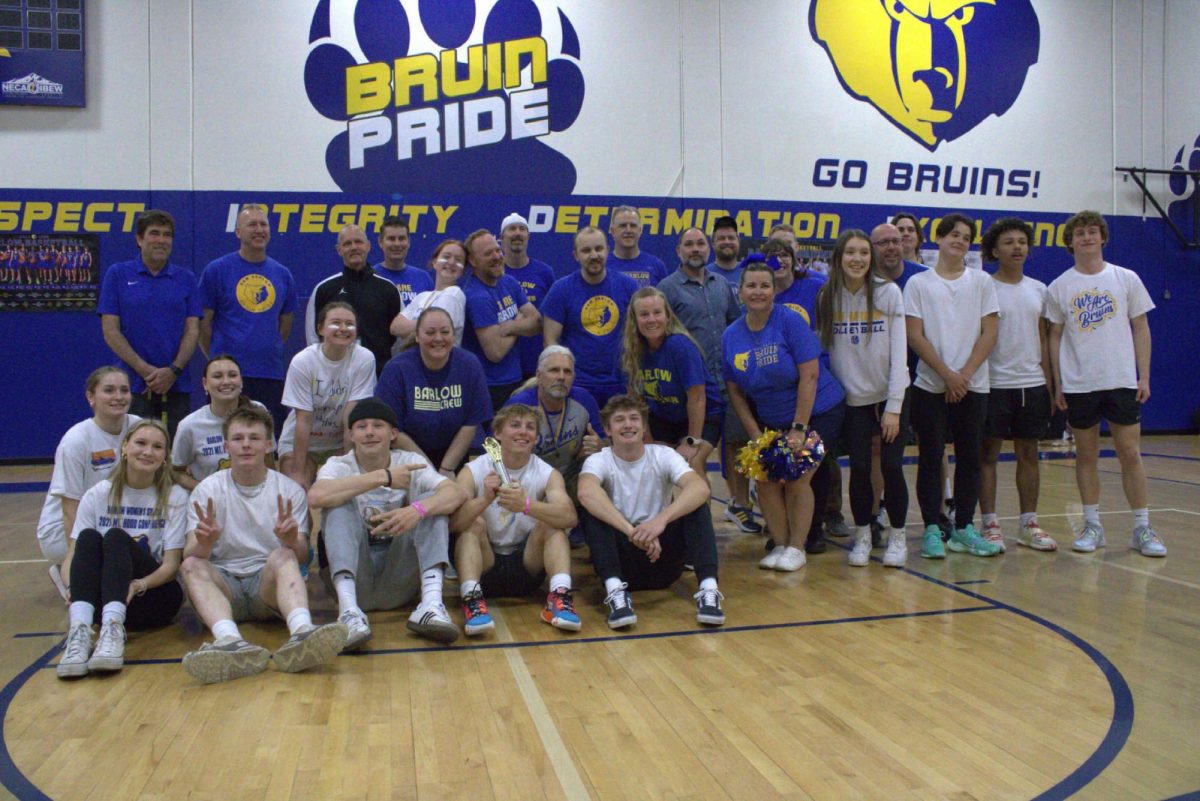 Both teams pose after the Staff vs. Student volleyball game on Monday, April 8, 2024.