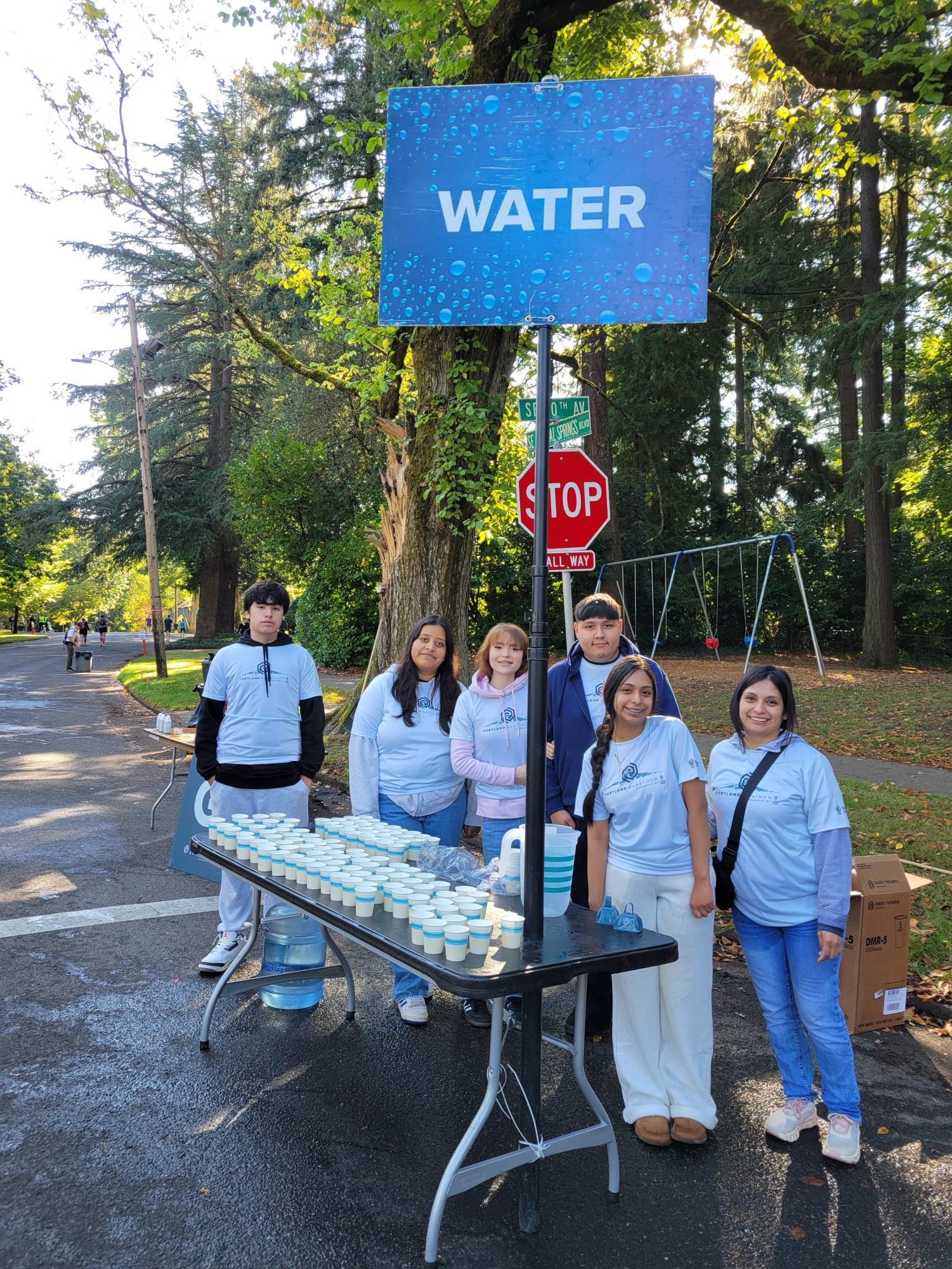 Barlow volunteers running a water station at the Portland Marathon on October 6th, 2024.