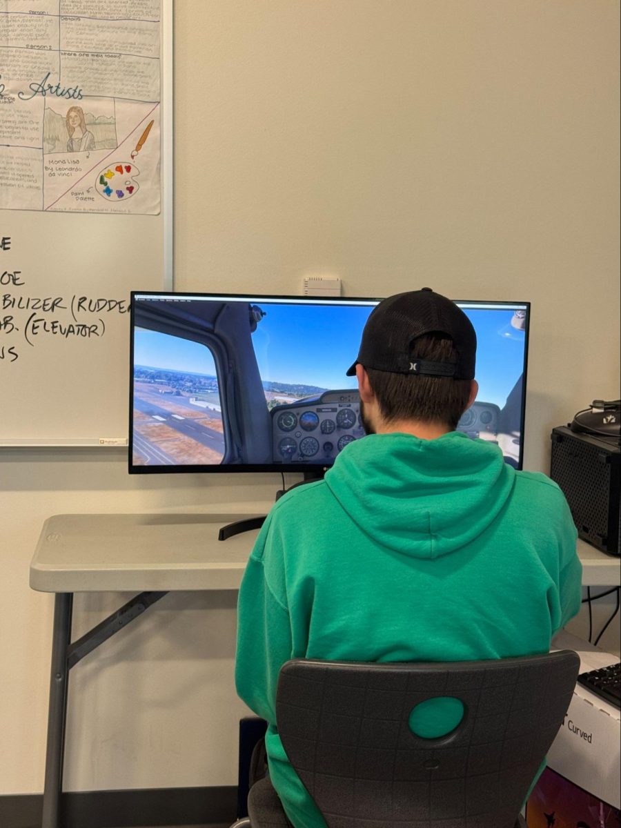 Giovanni Spillett enjoying the flight simulator during Flight Club.