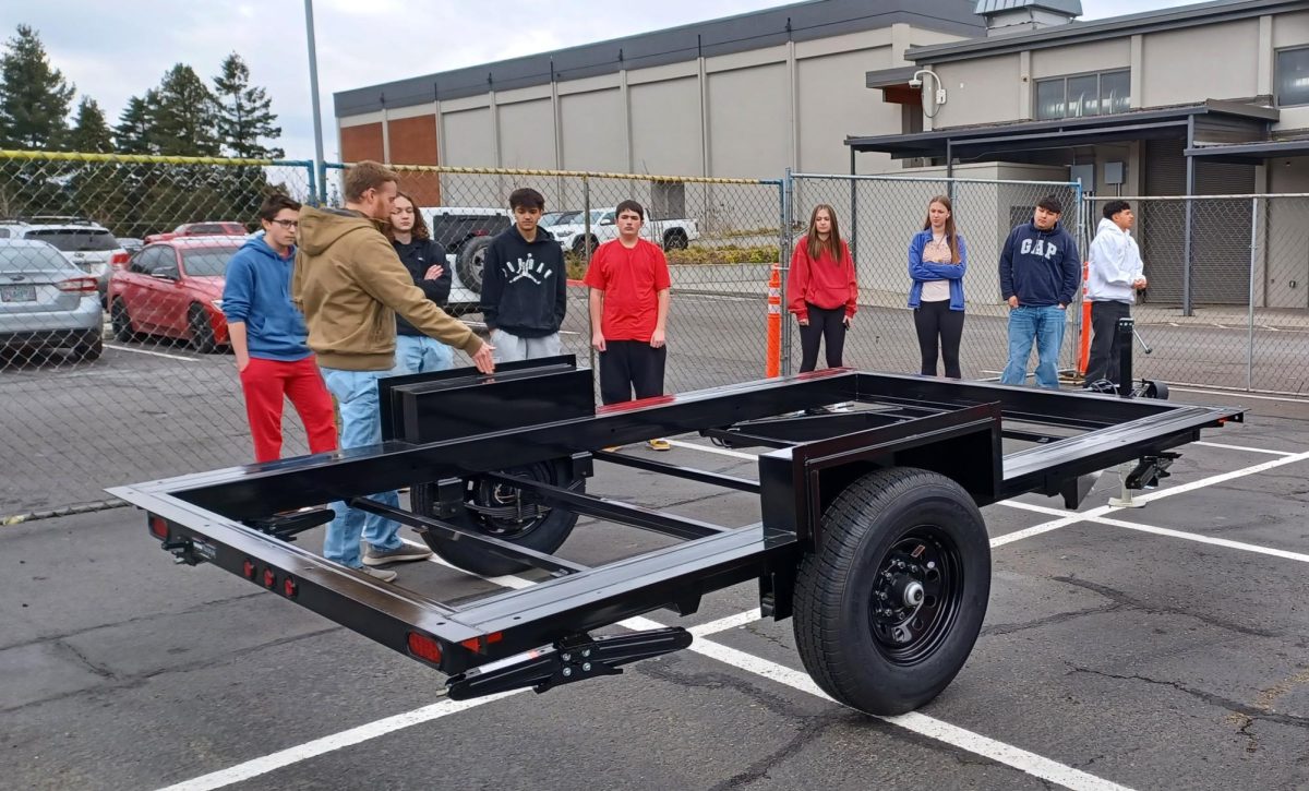 Mr. Hardy giving a brief explanation on the tiny home project that will be  built on the trailer to his Woods 2/3 class.