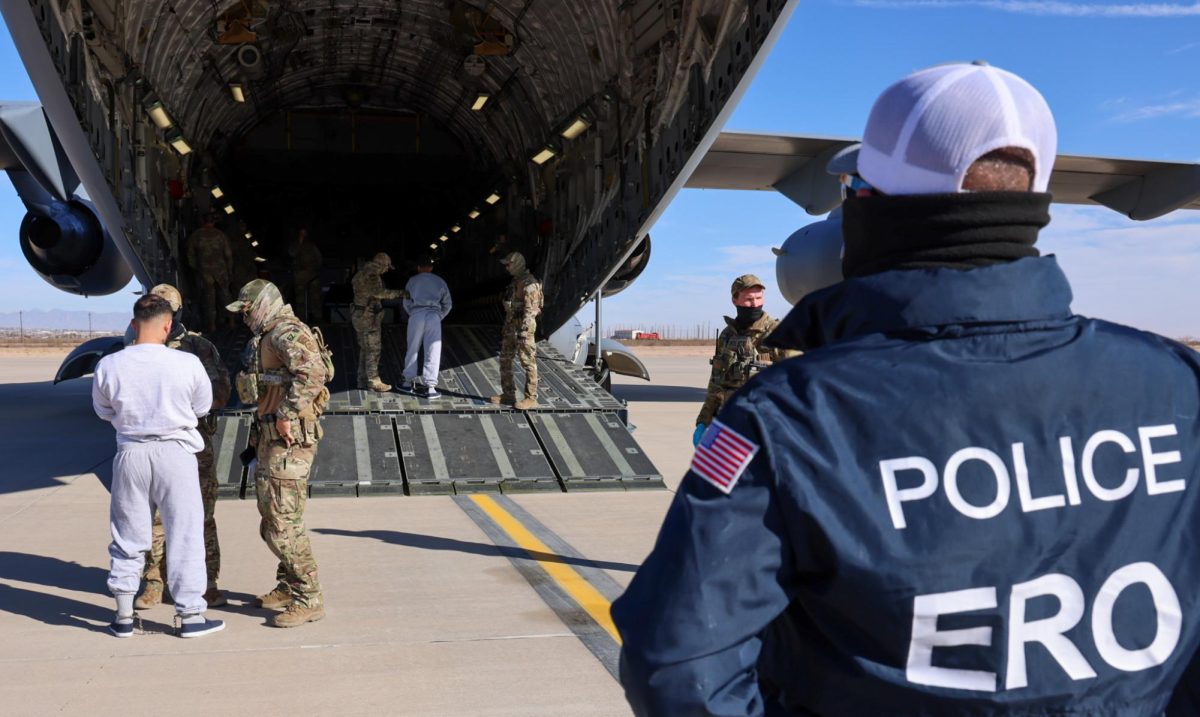  11 migrants are loaded onto the first plane bound for Guantanamo Bay on February 4th.