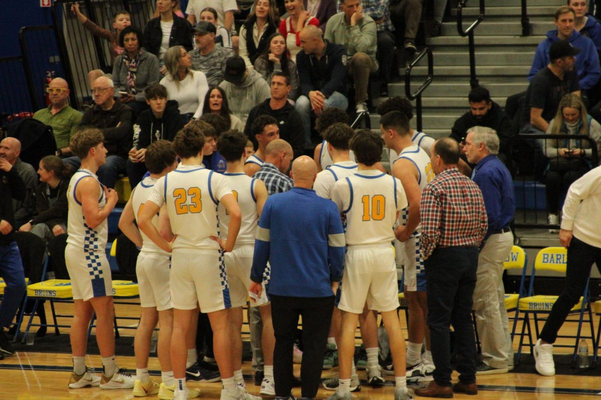 Tom Johnson’s Boys Basketball team celebrates 700 career wins as coach and being number 1 in the state.