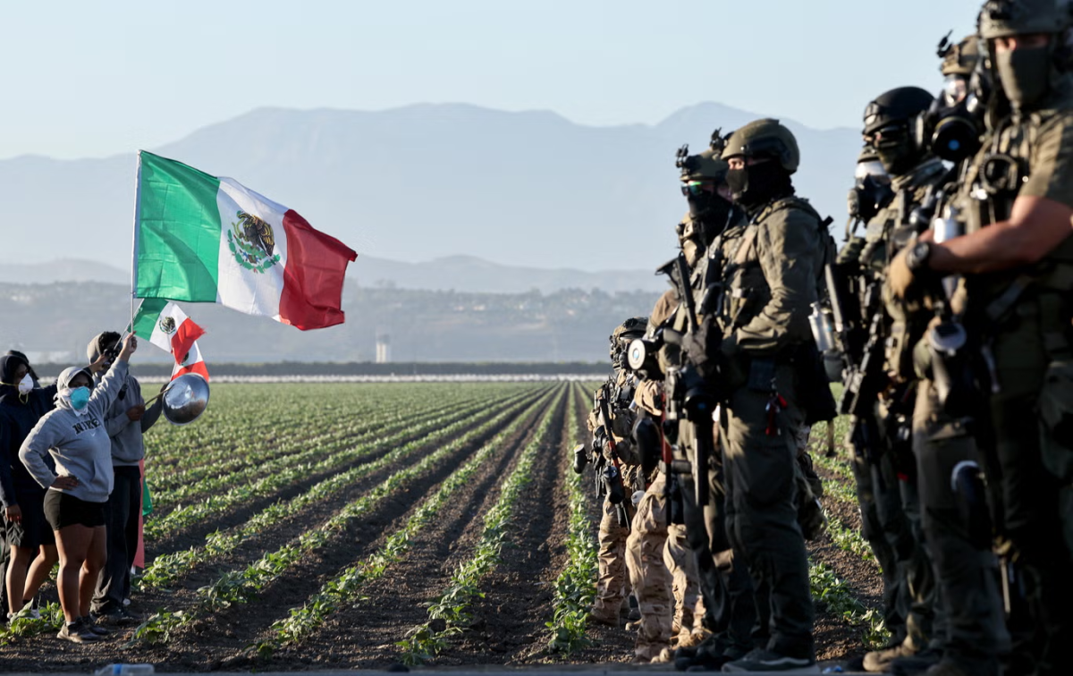 Protesters stand against ICE raid at a Southern California farm on July 11, 2025.