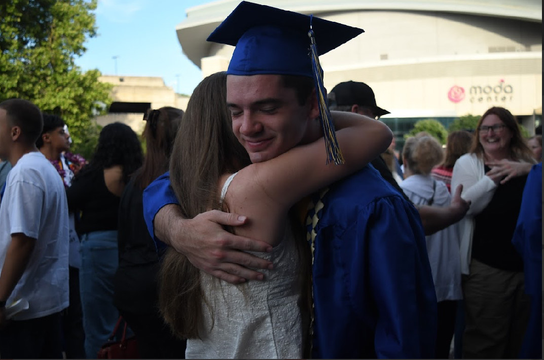 Two Barlow Bruins embrace after one graduates from Sam Barlow at the Moda Center, on June 10th, 2025.