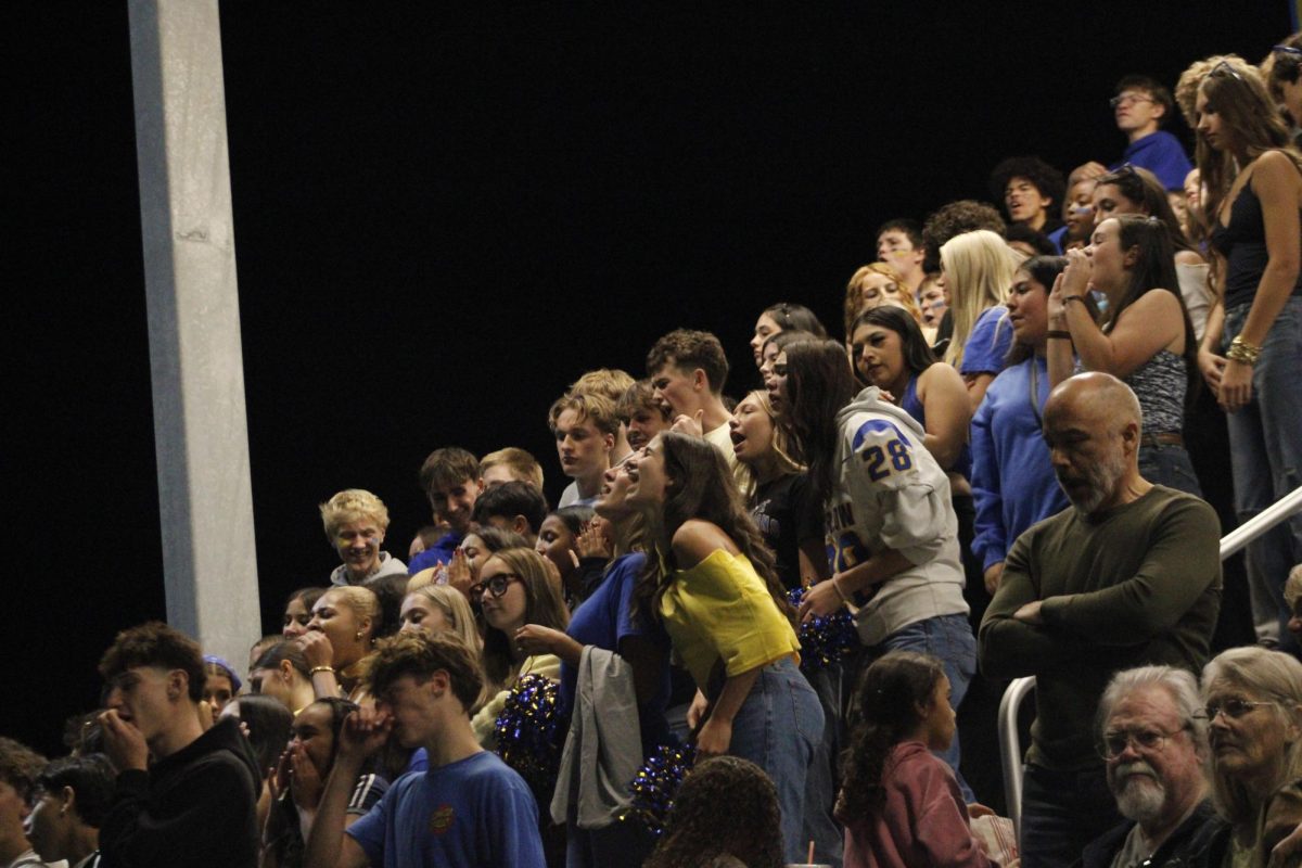 The Sam Barlow High School student section cheers on their football team during the homecoming game on Friday, September 12th. 

