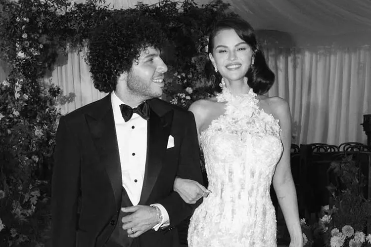 Newlywed Selena Gomez smiles at the camera while with her husband, Benny Blanco, on their wedding day.

