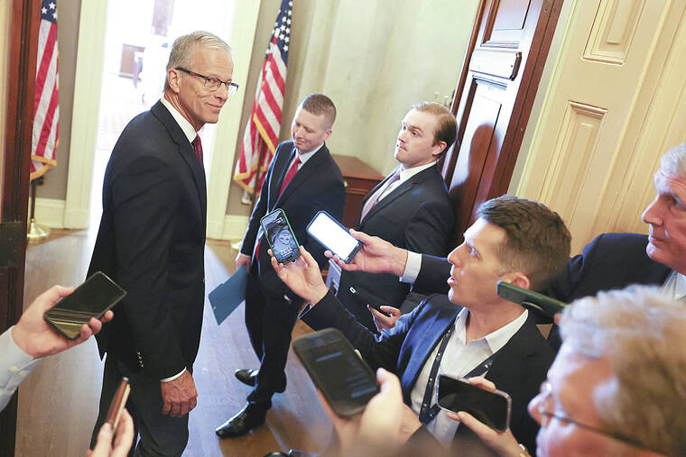 Senate Majority Leader John Thune, who helped pass the $9 billion recission bill, speaks with reporters at the door to his offices at the U.S. Capitol on July 17, 2025