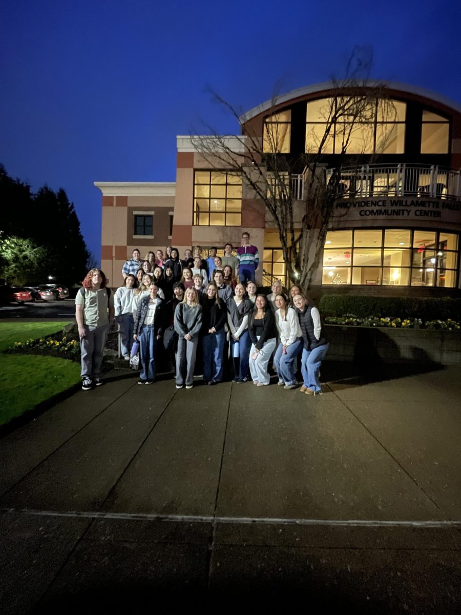 The Anatomy and Physiology students pose for a picture at Willamette Community Center before going to watch the open heart surgery.