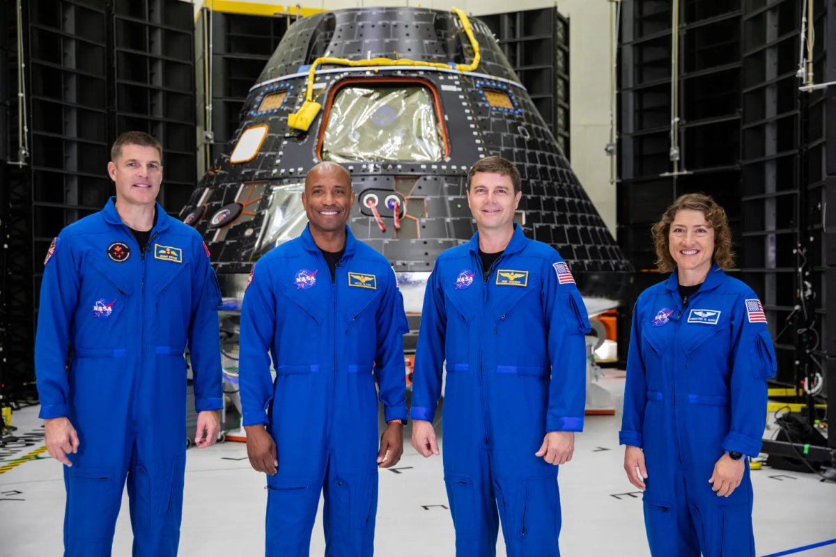 Caption: On August 8, 2023, the Artemis II crew prepared for the mission in front of the Orion crew module. From left, Jeremy Hansen, Victor Glover, Reid Wiseman, Christina Hammock Koch

