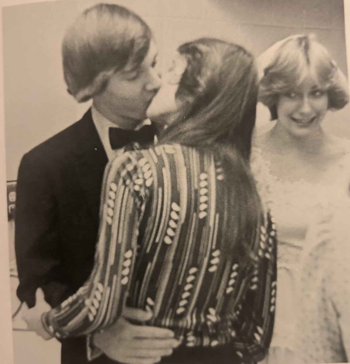 Mock-Wedding put on by Sam Barlow’s family living class in 1978. Caption of original photo states, “It didn't take long for Ray Kramer to fall into the arms of another woman (Lori Raymond). Bride Sue Holm is everything but upset.”