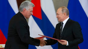 Russian President Vladimir Putin (left) and Cuban President Miguel Diaz-Canel (right) shake hands during a bilateral meeting in Moscow, Russia, on November 2, 2018 to strengthen their economic and diplomatic ties.